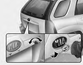 Opening the rear hatch window (if equipped) The rear hatch window lock is operated