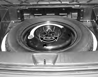 Removing the spare tire Turn the tire hold-down wing bolt counterclockwise. Store