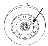 3. Lay the tire on the ground with the valve stem facing down. If your