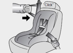 4. Slowly allow the shoulder portion of the safety belt to retract and listen