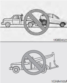 NOTICE • Do not tow the vehicle backwards with the front wheels on the ground