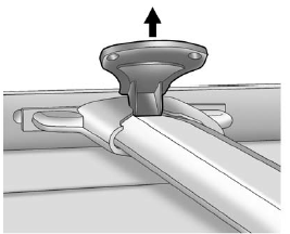 Lift the lever to release and move the cross rail.