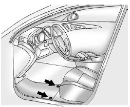 The driver side floor mat is held in place by two retainers.