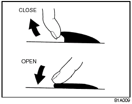To open a window, push the top part of the switch and to close the window lift