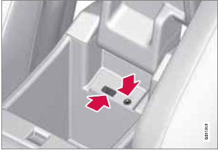 Sockets for auxiliary devices in the storage compartment between the front