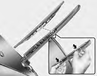 2. Install the new blade assembly by inserting the center part (➀) into the slot